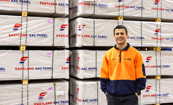 Worker standing in front of Eastland AAC Panel products