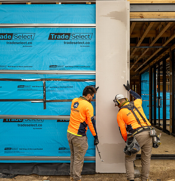 Workers working with cladding